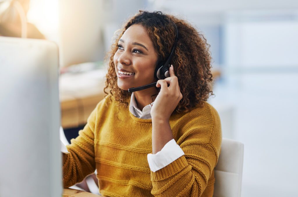 image of a happy care coordinator on phone